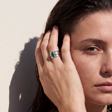 The Brave Malachite ring resting on natural linen