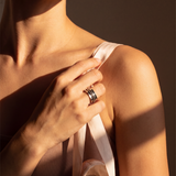 A woman's hand wearing the Rope 316L stainless steel spinner ring
