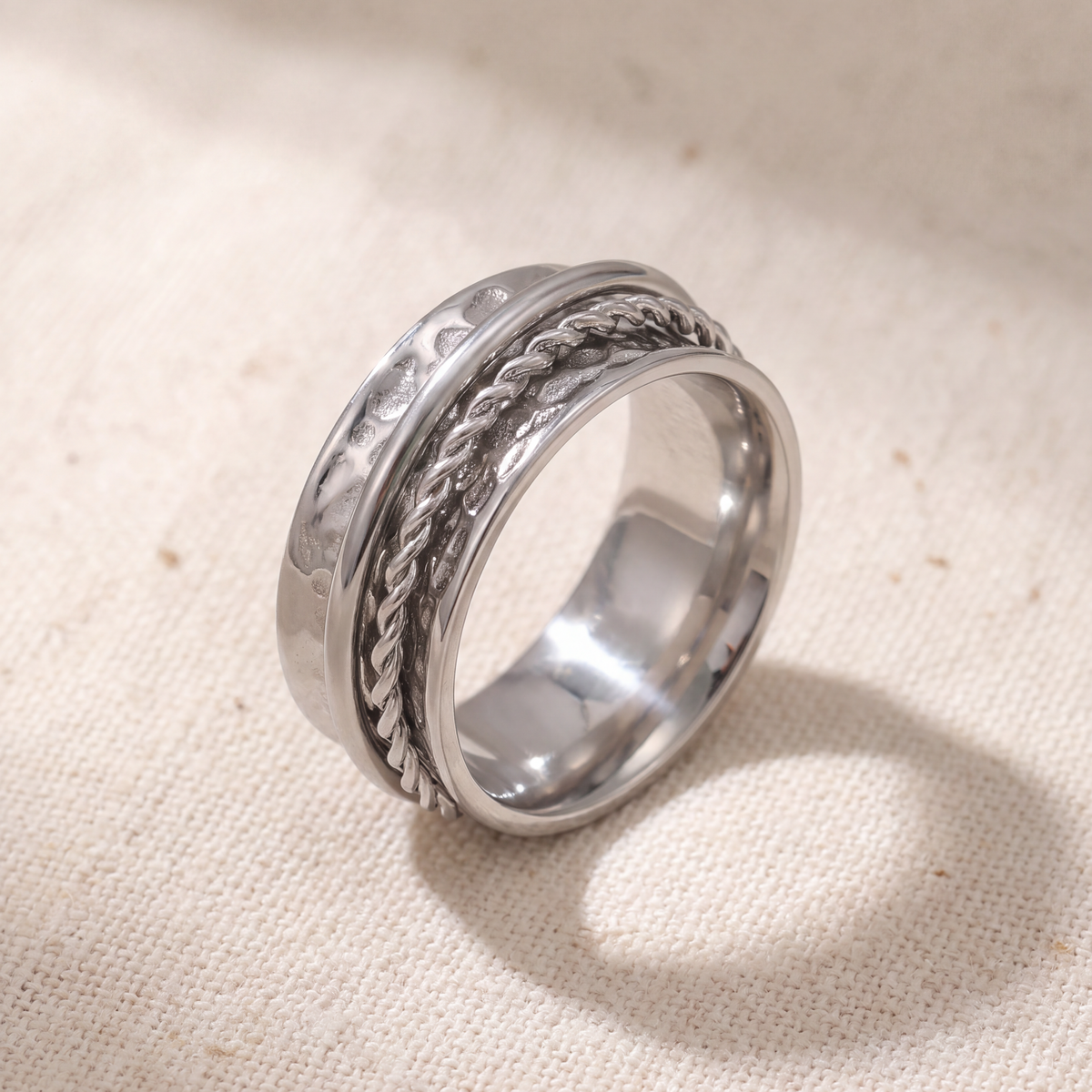 Close view of a rope twist and a plain band turning on the Rope ring