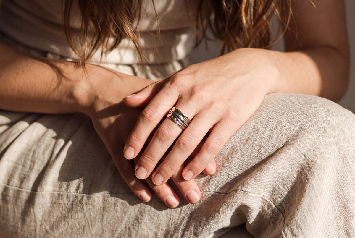 Worn, seated, hands at rest