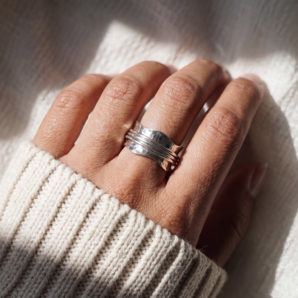 Tranquillity spinning ring worn