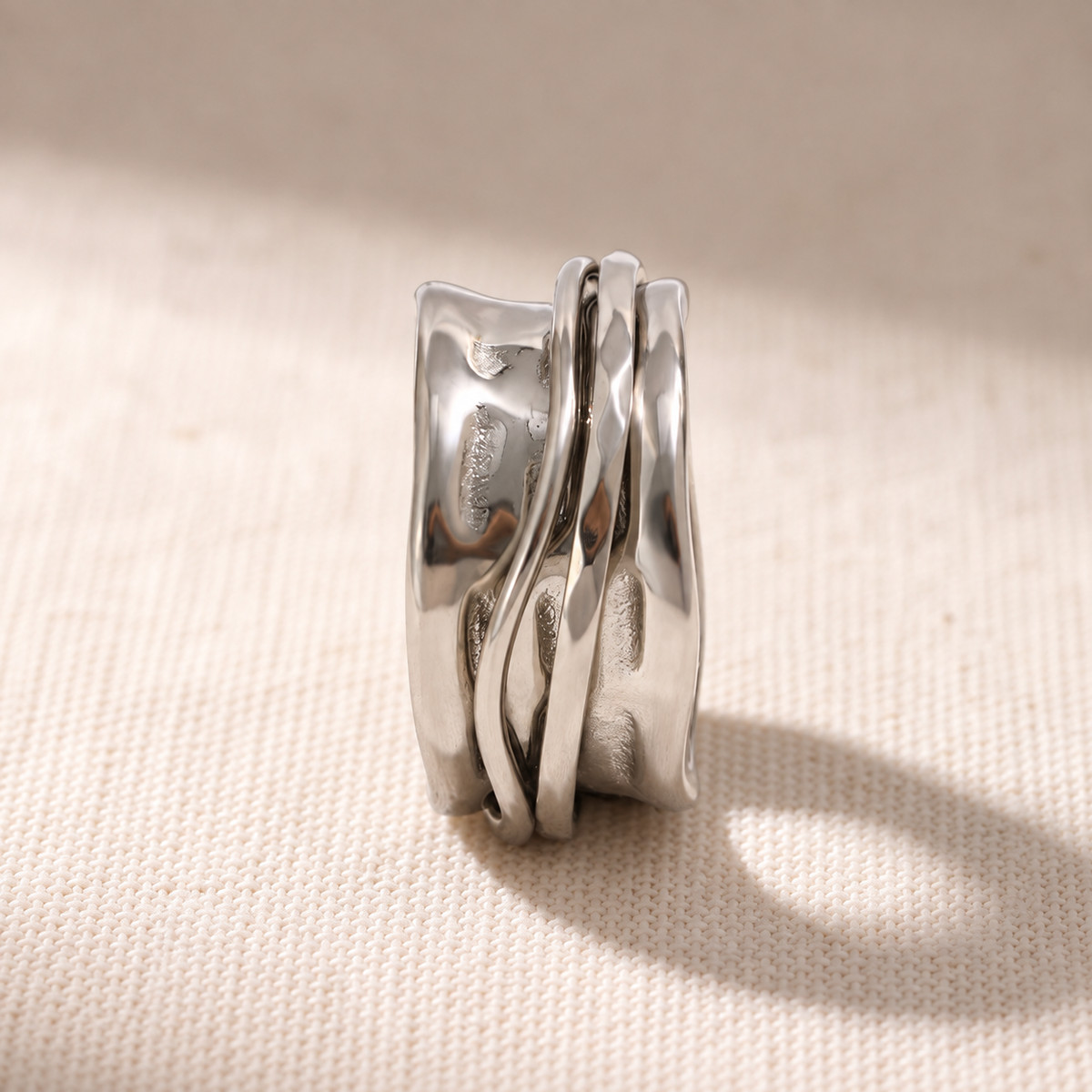 The Molten 316L stainless steel spinner ring worn on the hand